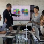 Mixed race business people having discussion in a meeting at modern office