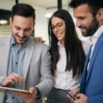 Picture of businesspeople using digital tablet in office